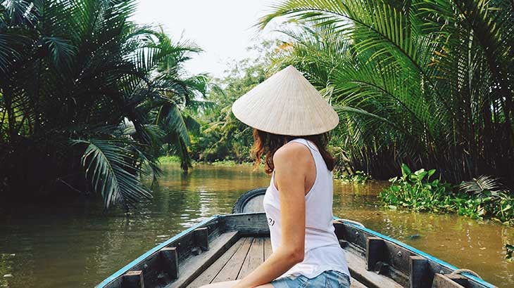 Young tourist rides on a Sampan