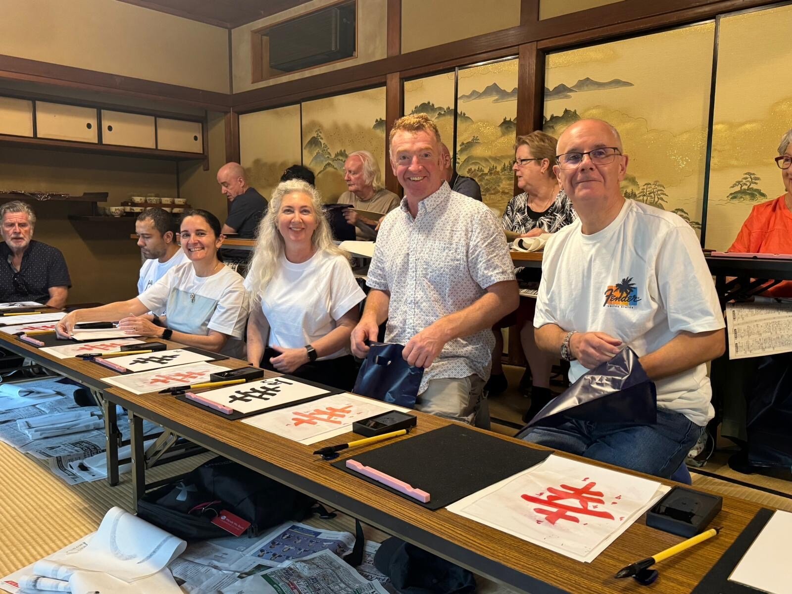 Mercedes with new friends learning caligraphy in Kyoto_On tour with Wendy Wu Tours. Photo supplied by Mercedes Maguire