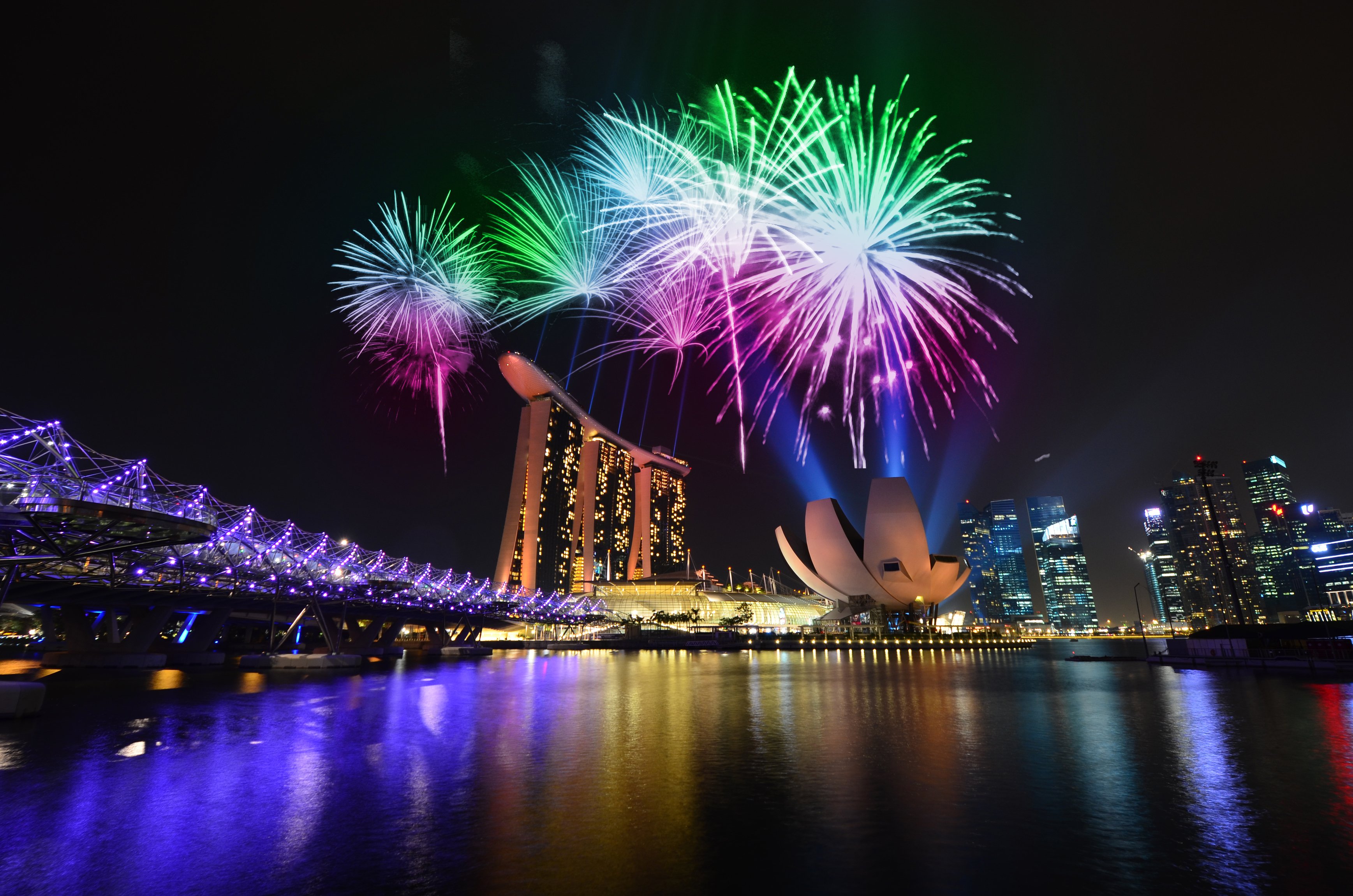 Fireworks over Marina Bay Sands, Hong Kong vs Singapore