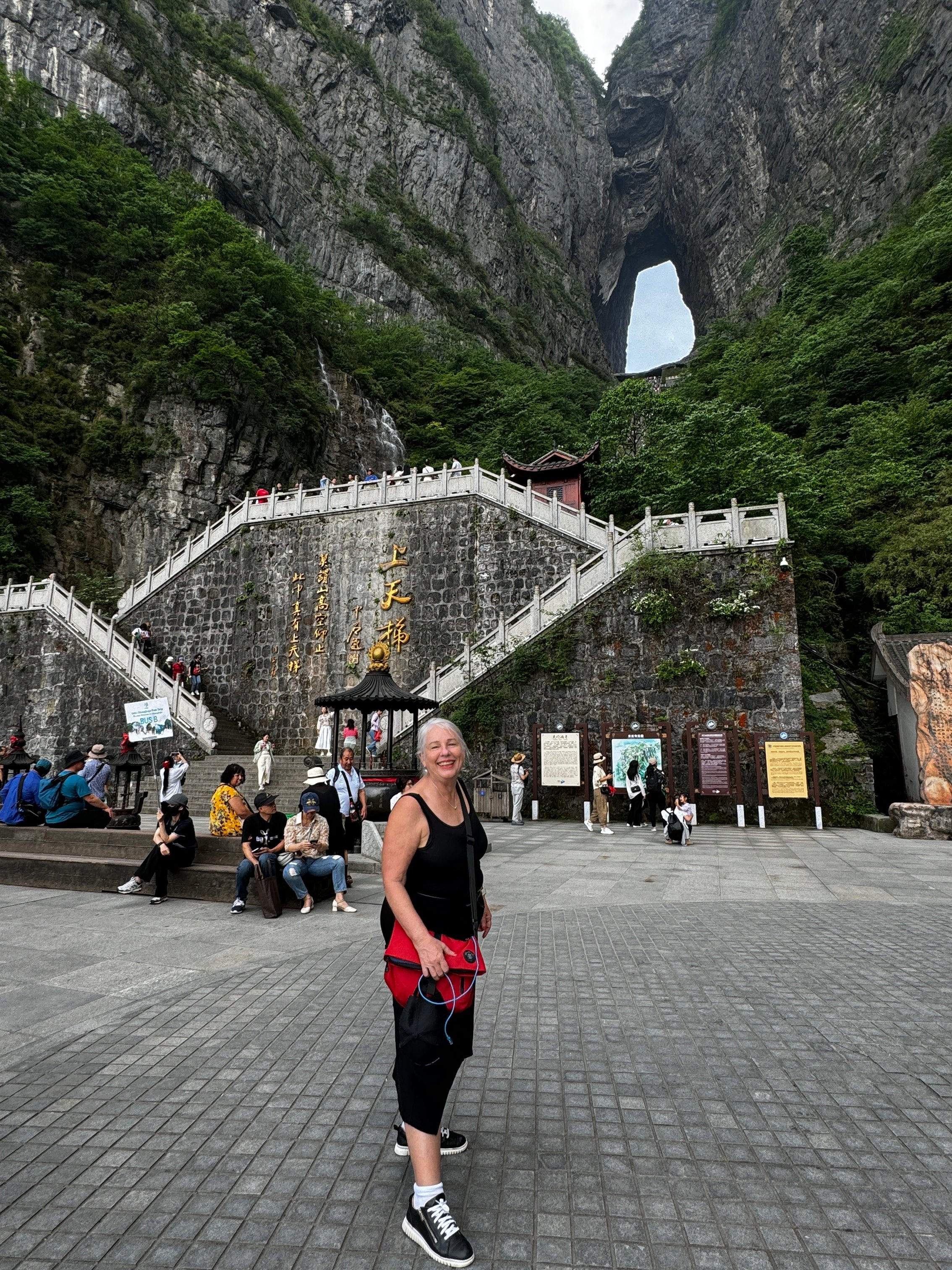 Kerry Heaney in front of Tianmen Cave and the 999 steps